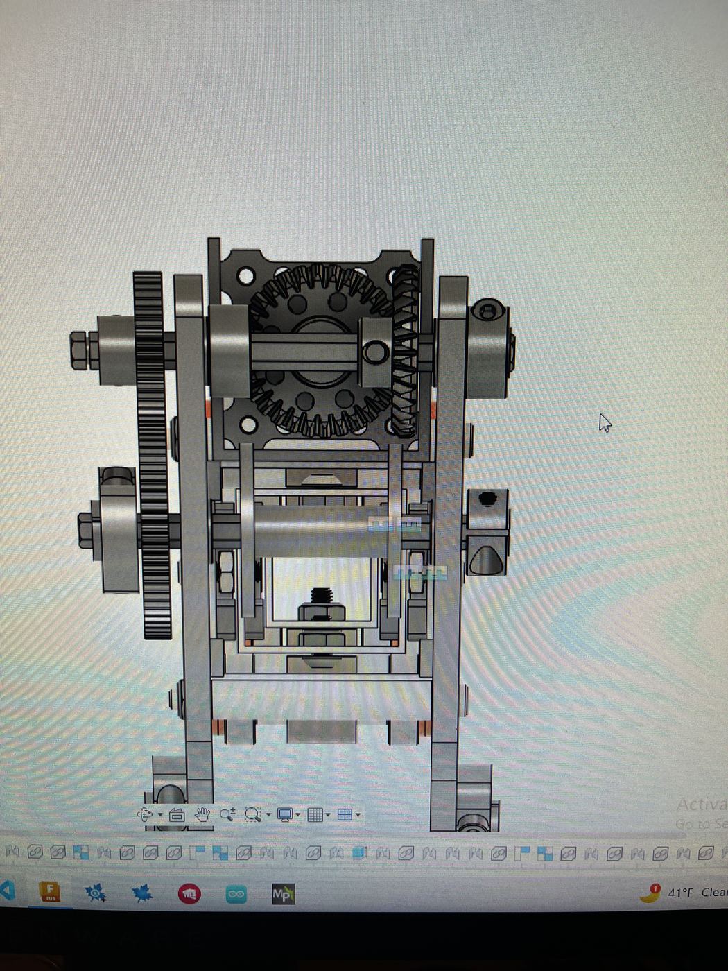 Front view of the gear reduction, showing the stacked spur gears and output shaft.