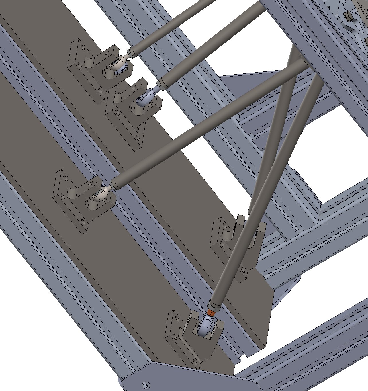 Inboard pickup mounts — custom machined brackets reproducing the chassis geometry on t-slot extrusion.