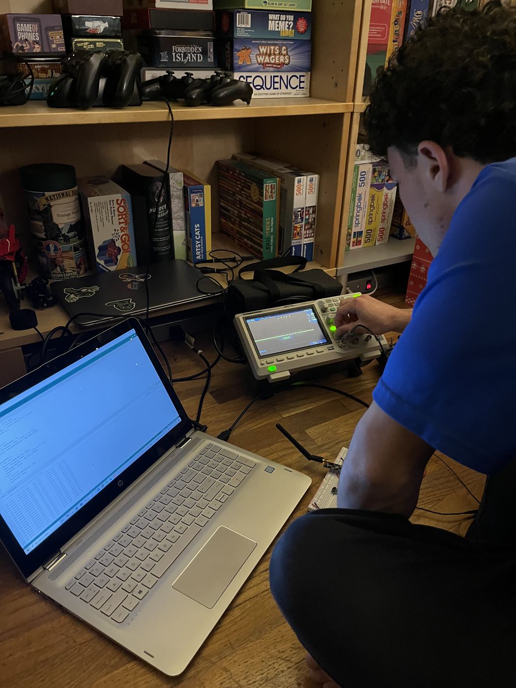 Working through the signal chain on the oscilloscope with the firmware open on the laptop.